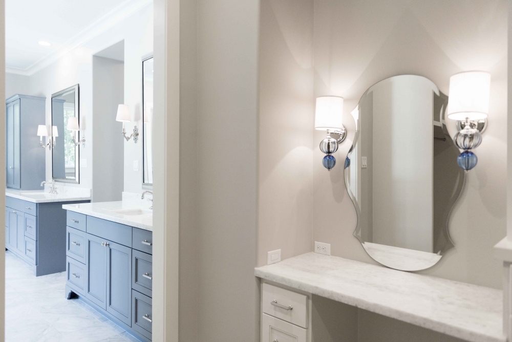 large bathroom with vanity and sconce