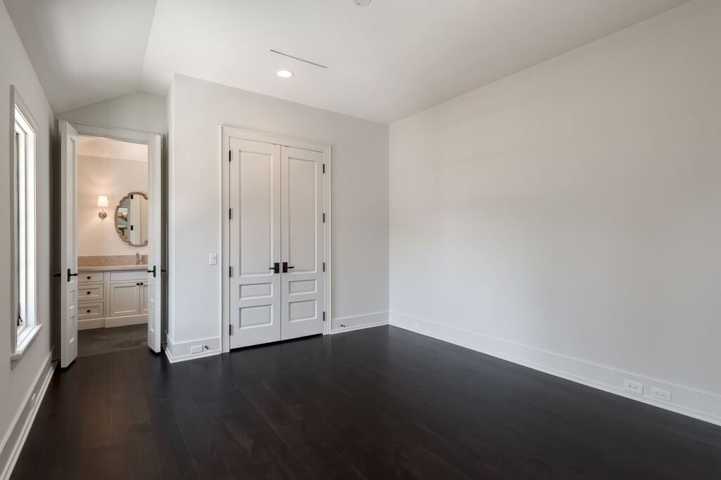 River Oaks Del Monte custom home bedroom, dark wood floors
