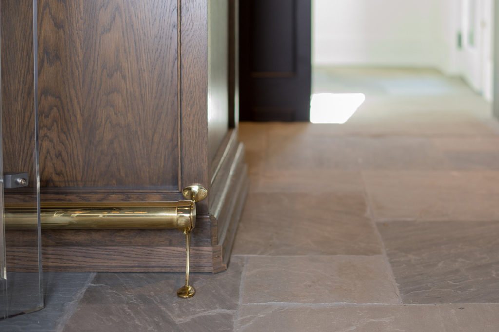 river oaks custom build wet bar with foot rail, brass foot rail