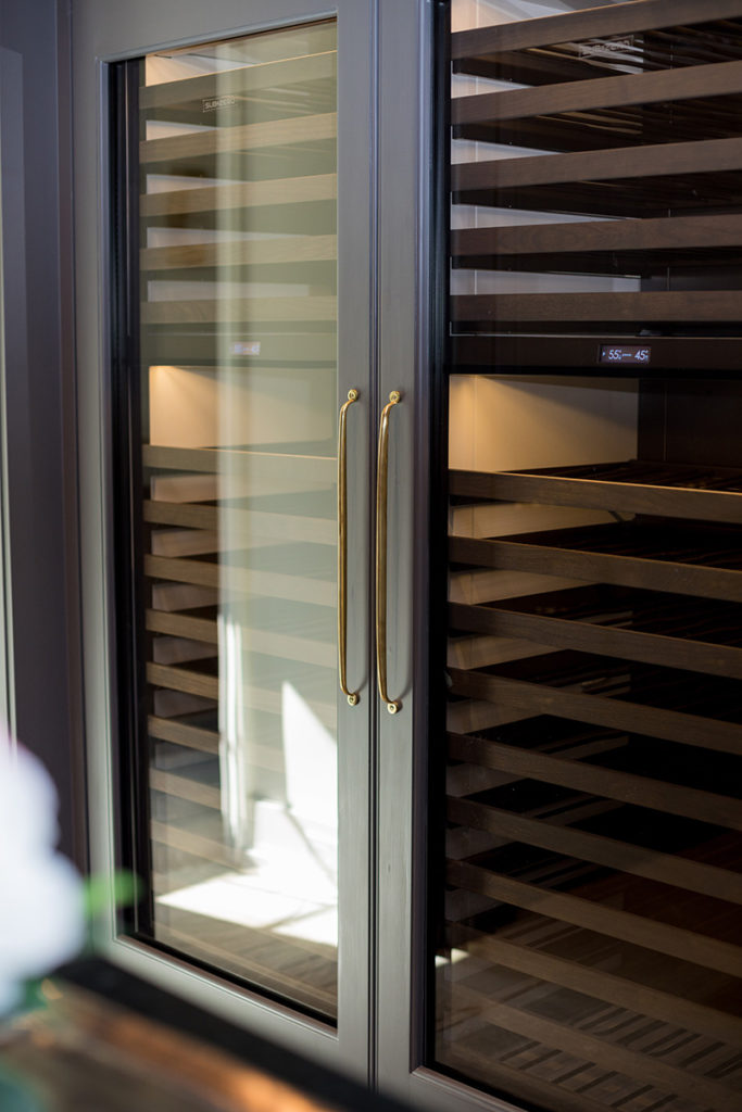 custom home with lounge room, wine refrigerator