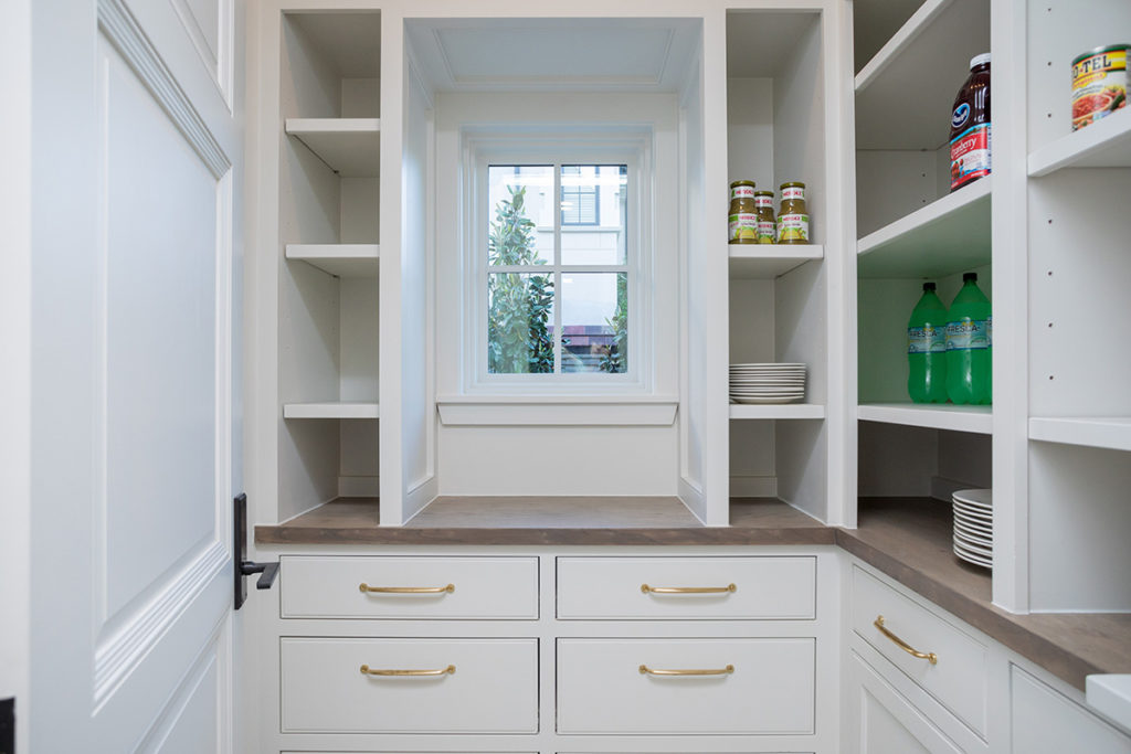 custom home builder pantry with stay storage, white oak counter