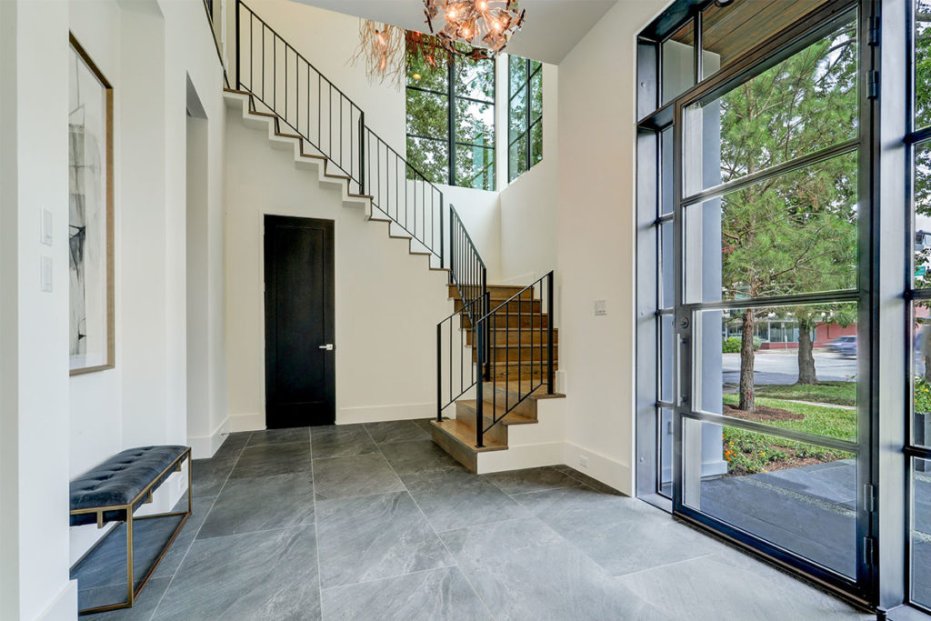 stone-floor-and-modern-chandelier-in-foyer
