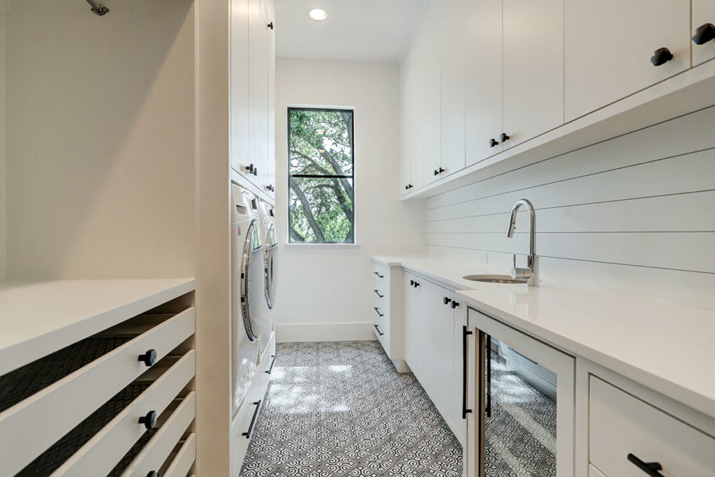 utility-room-with-built-ins-and-custom-tile