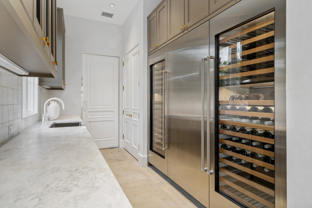 Scullery with plenty of workspace and storage, dual built-in SubZero wine coolers